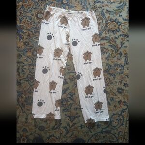 white dog patterned pajama pants with paw prints with "paws off!" Size Large
